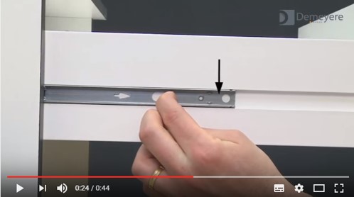 Assembly of a drawer with ball-bearing slides